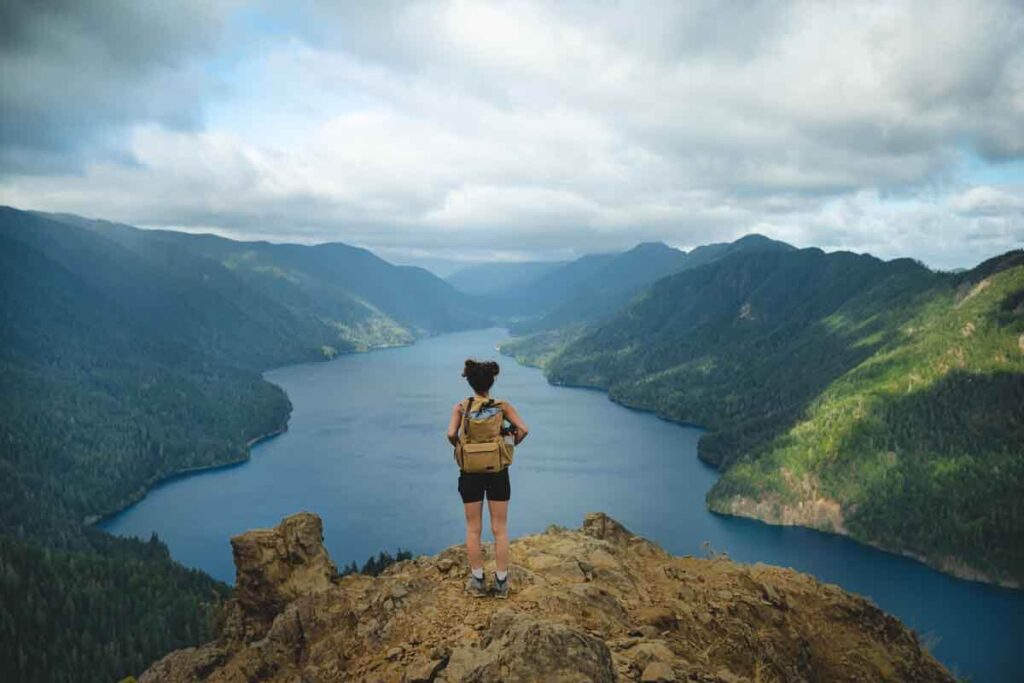 Nina and the summit of Mount Storm King in Olympic National Park, Lake Crescent is below.